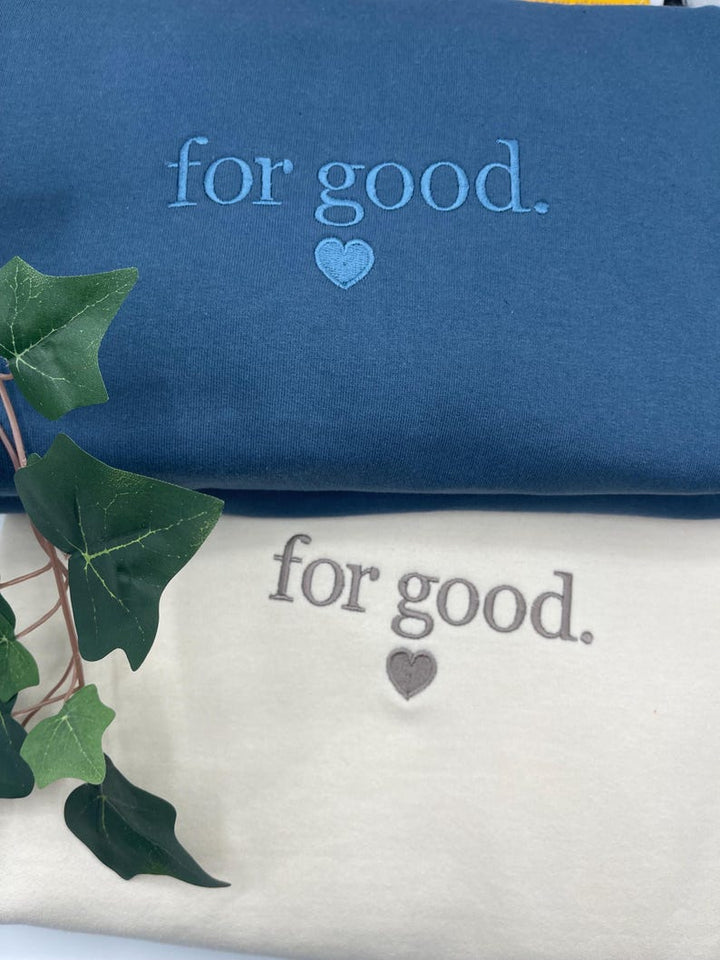 Blue and Milkshake embroidered sweatshirts with “For Good.” text and heart