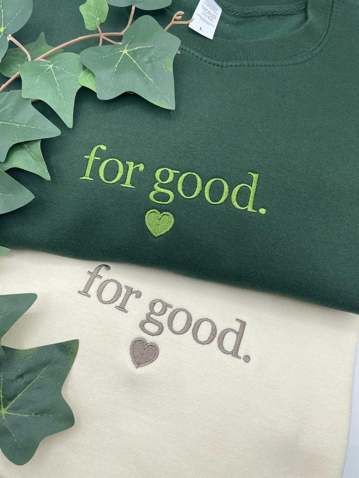 Green and Milkshake embroidered sweatshirts with “For Good.” text design