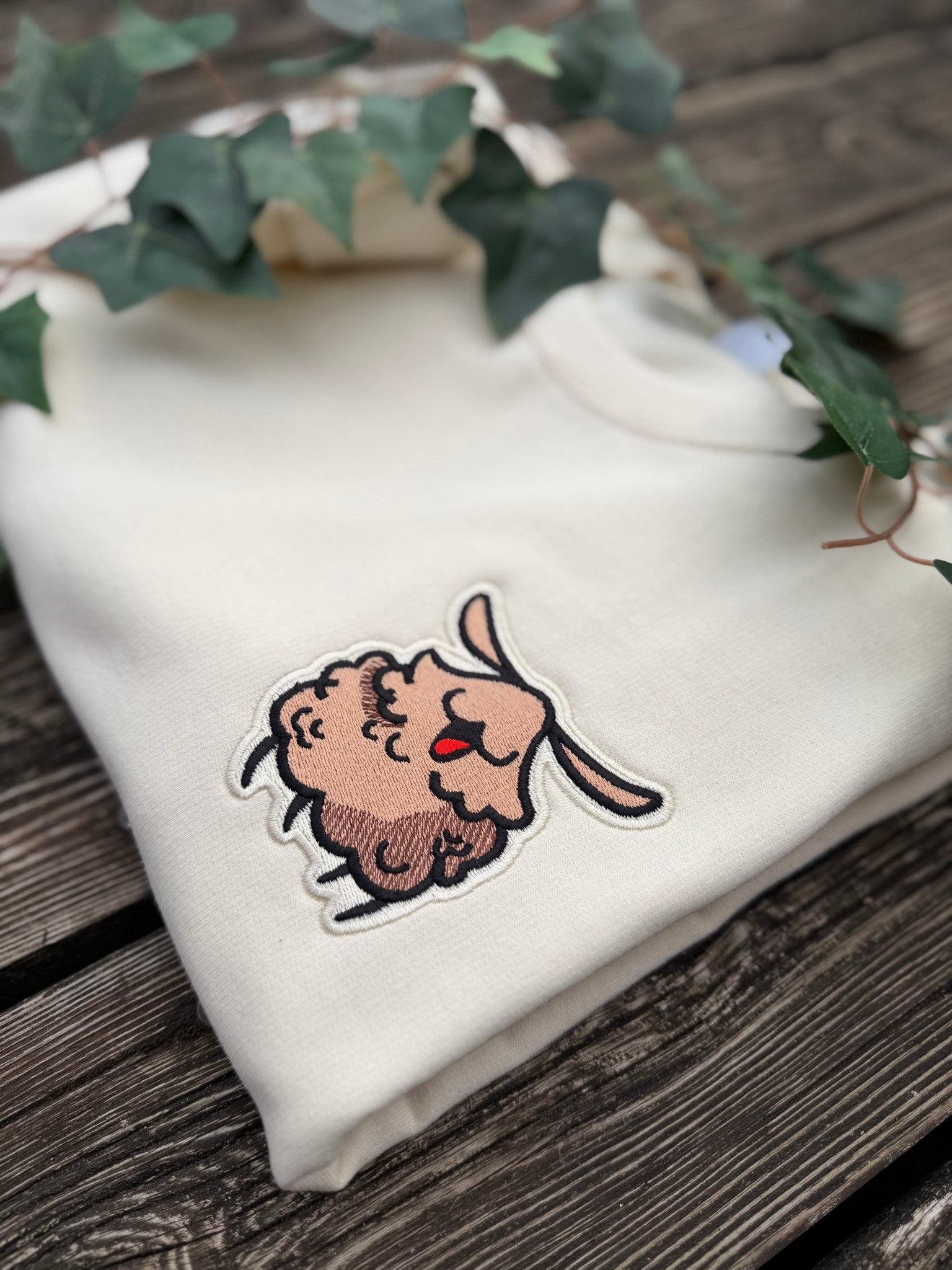 Milkshake sweatshirt with embroidered Silksong Flea patch