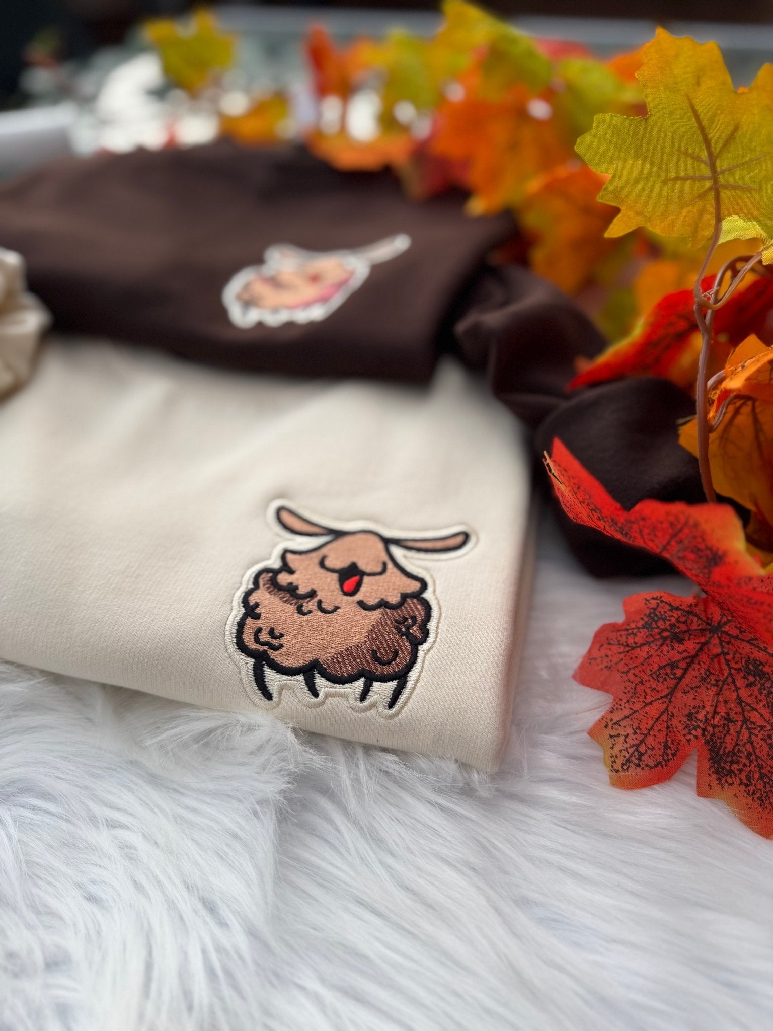 Embroidered Silksong Flea patch on Milkshake sweatshirt